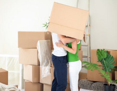 Packed boxes and moving truck near local homes in Primrose Hill