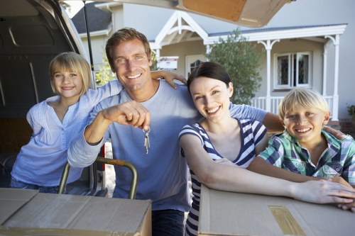 Careful wrapping of fragile household items during a Primrose Hill move