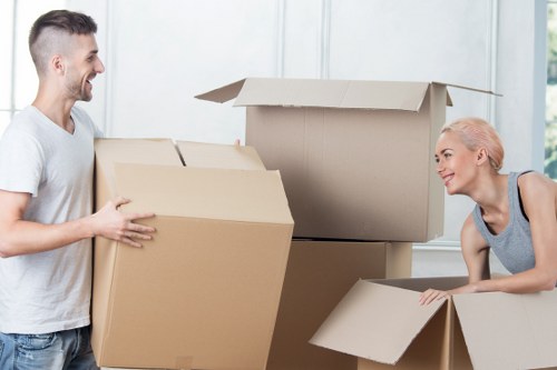 Local moving team in Primrose Hill transporting furniture