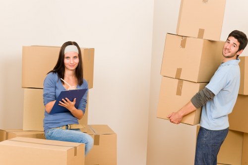 Packed moving boxes and furniture protection prepared for a Primrose Hill home removal