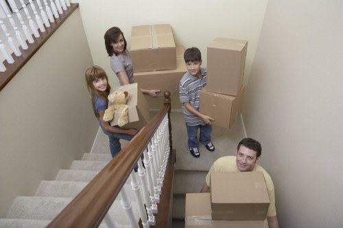 Local movers carrying boxes from a Primrose Hill flat